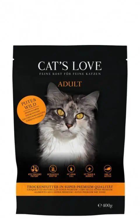 Opakowanie karmy CAT'S LOVE dla dorosłych kotów z indykiem i dziczyzną, z wizerunkiem kota i informacjami o składnikach.
