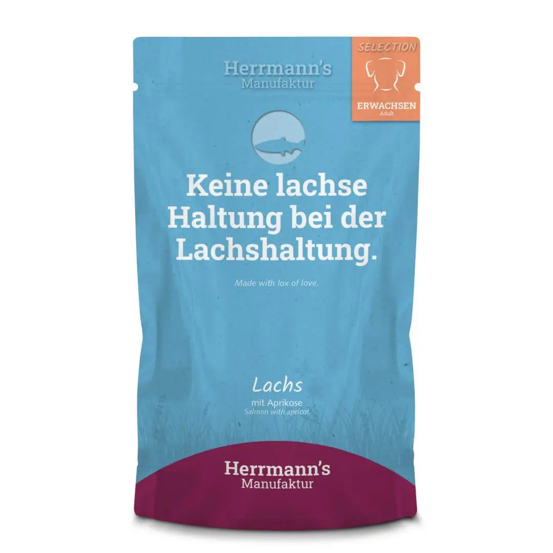 Opakowanie karmy dla psów Herrmann's Manufaktur Selection Lachs z łososiem i morelami, niebieskie z białym napisem i logo. Produkt dla dorosłych psów.