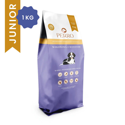 Opakowanie suchej karmy Perro Junior Wołowina z Batatami dla szczeniąt 1 kg z grafiką szczeniaka na fioletowym tle.